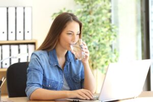 Female Employee Drinking Filtered Water