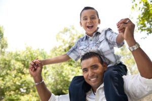 Latino Father And Son Piggy Back Image