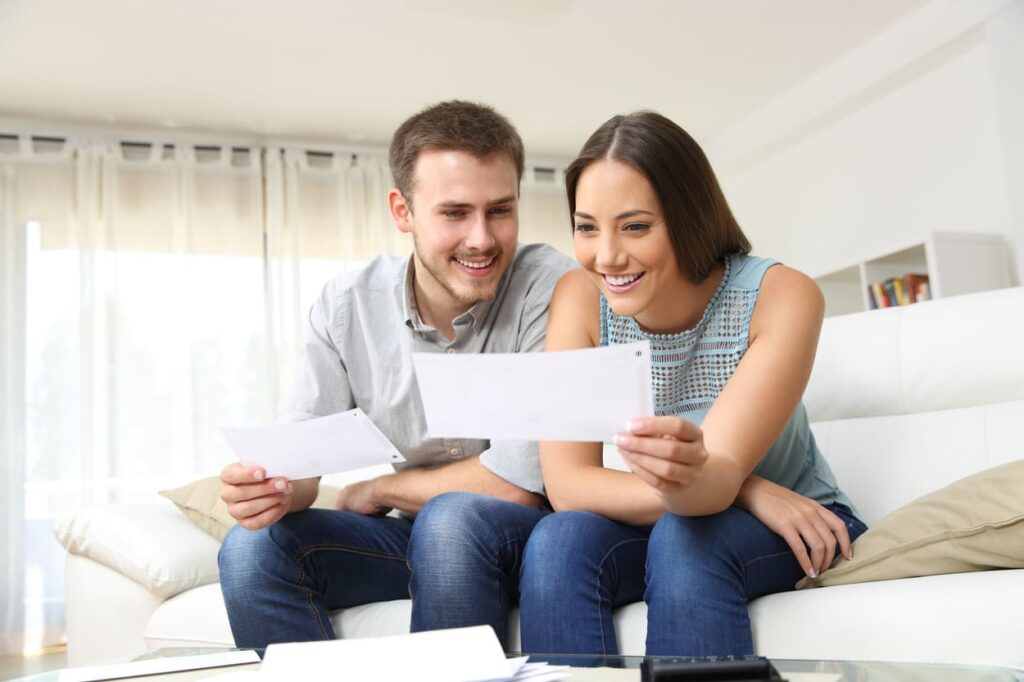 Young Couple Receiving State Rebate